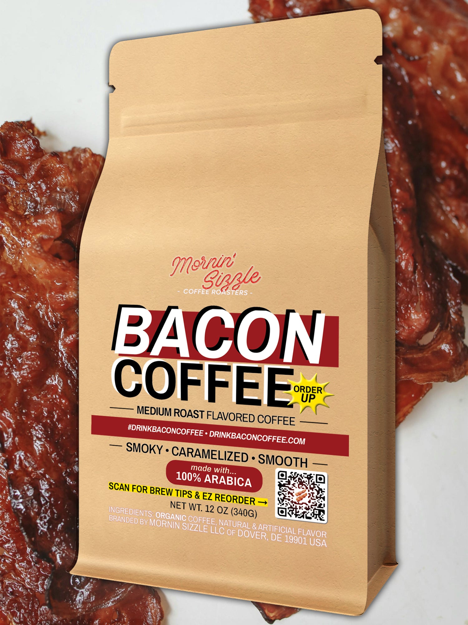 Mornin' Sizzle 12 oz Bacon Coffee bag laid on bacon strips